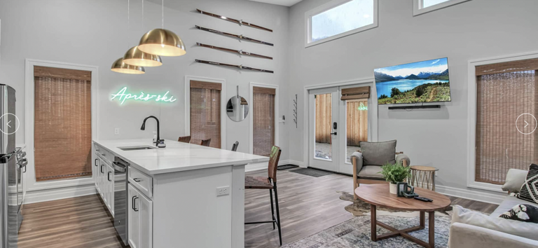 Modern Living Room With Kitchen And Neon Sign