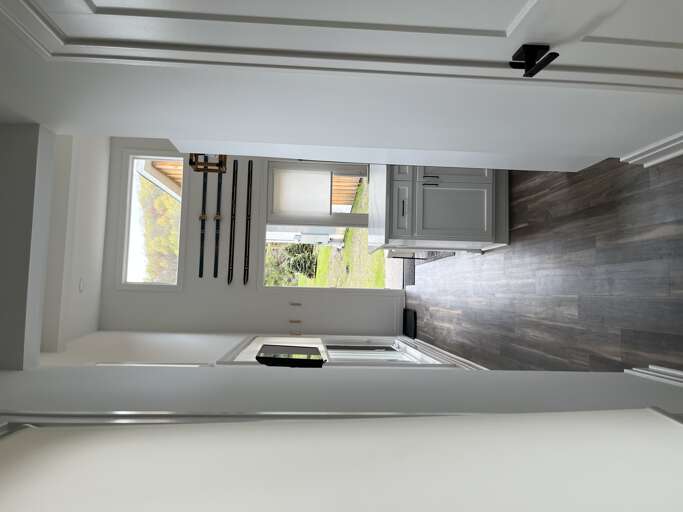 Interior Hallway Leading To A Room With Open Door