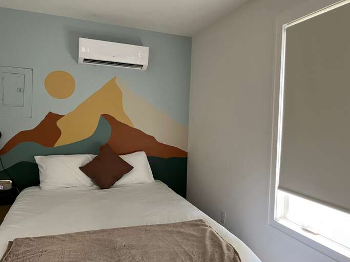 Interior Room With Mural, Bed, And Window