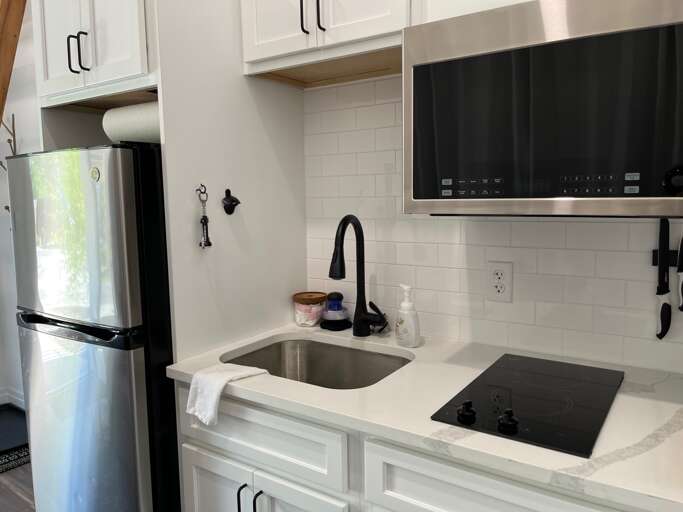 Modern Kitchen Interior With Sink, Stove, And Refrigerator
