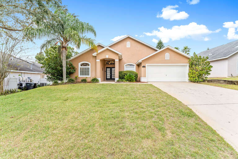 Suburban Single-family House With Lawn And Driveway Suburban Single-family House With Lawn And Driveway