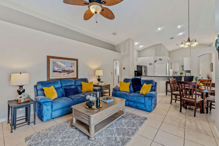 Living room with comfortable couches. One couch has a recliner. Living room with comfortable couches. One couch has a recliner.