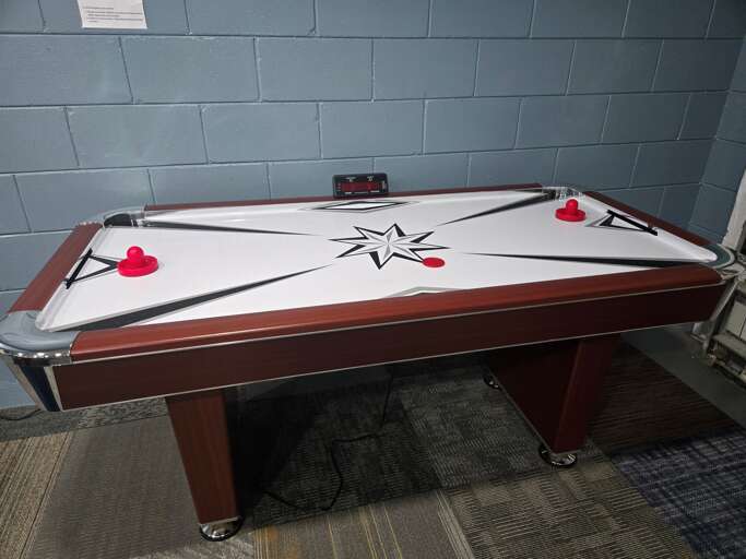 Air hockey in game room