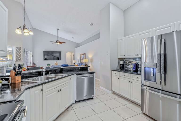 Kitchen with stainless steel appliances - Serhii Villa Orlando
