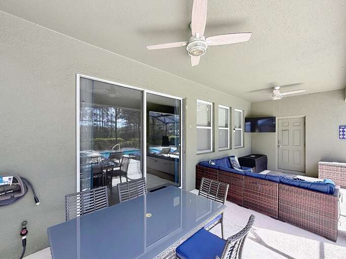 Patio With Pool View, Glass Table, Wicker Seating