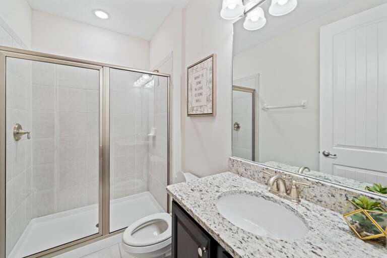 Bathroom with glass enclosed shower