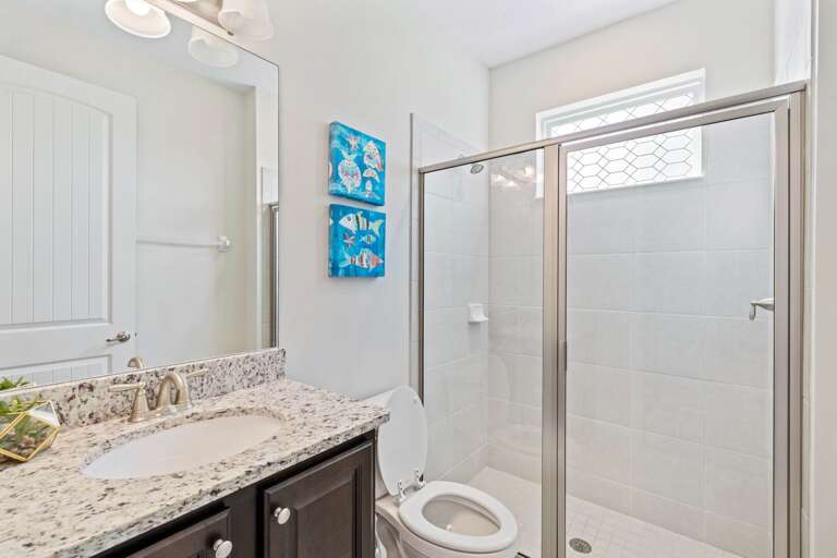 Bathroom with glass enclosed shower