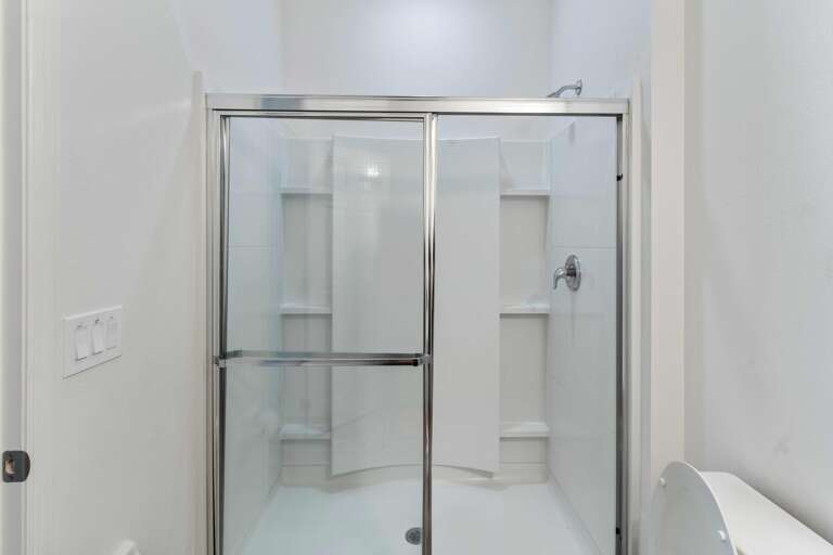 Bathroom with glass enclosed shower Bathroom with glass enclosed shower