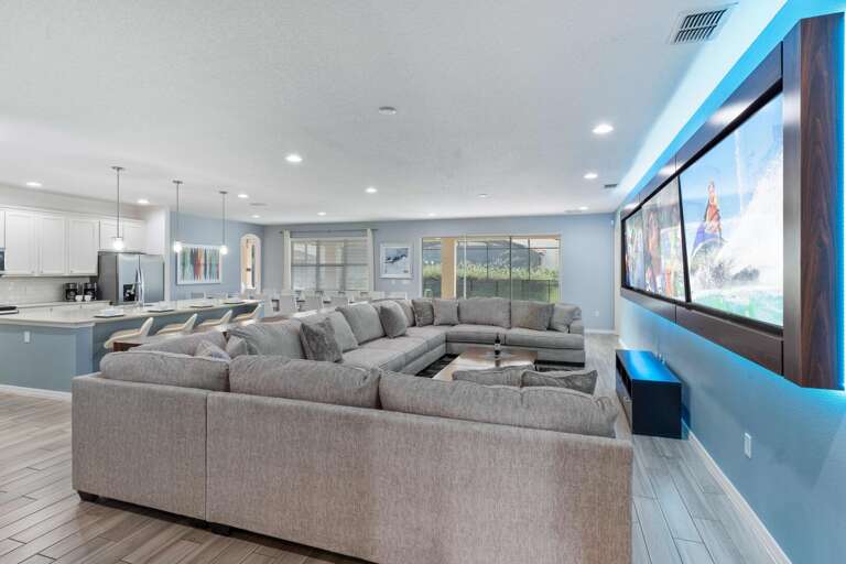 Living area w/ triple 86" TV wall Living area w/ triple 86" TV wall