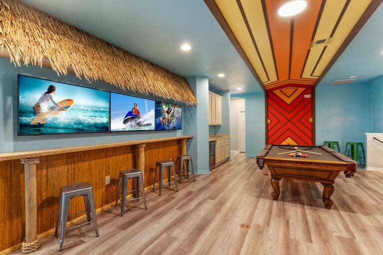 Polynesian themed game room w/ Fast and Furious Racing Arcades and pool table Polynesian themed game room w/ Fast and Furious Racing Arcades and pool table