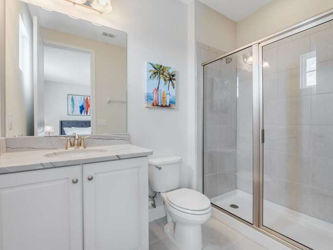 Bathroom with glass enclosed shower