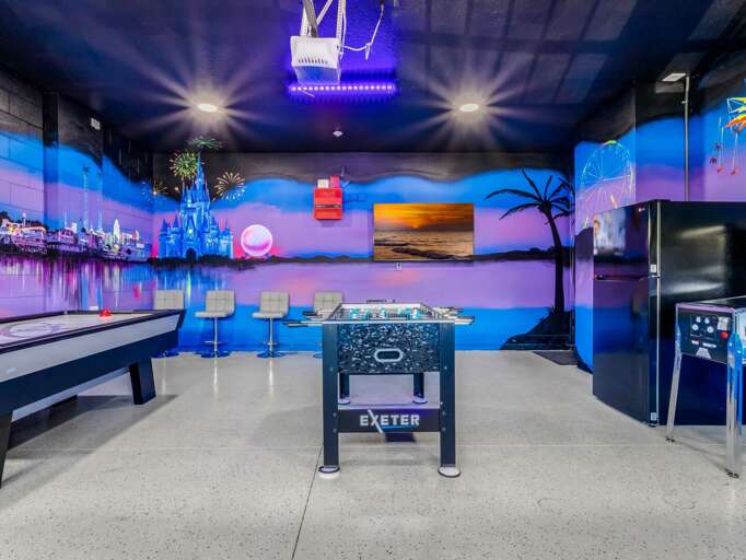 Game area with pool table, foosball, and arcades