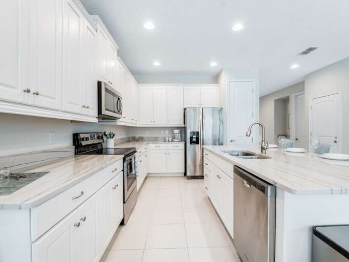 Kitchen area with stainless-steel appliances and spacious island