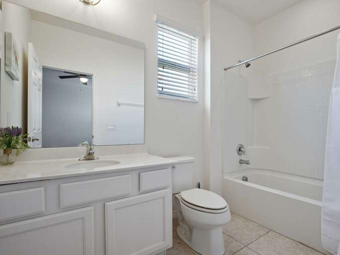 Bathroom with bathtub and shower combo