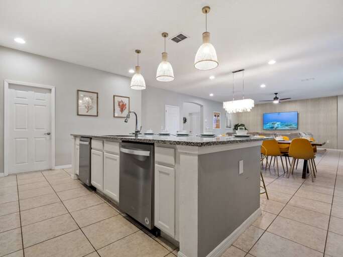 Kitchen area with stainless steel appliances and spacious island