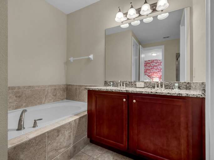 Bathroom with dual sinks and soaker tub Bathroom with dual sinks and soaker tub