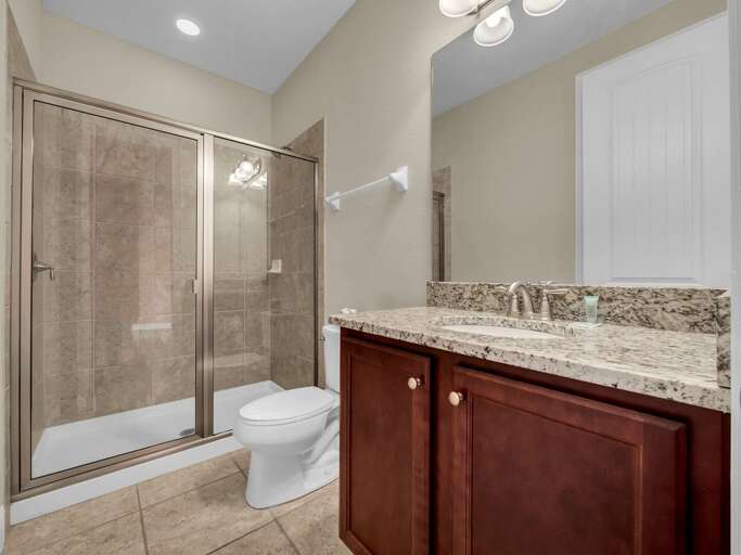 Bathroom with glass enclosed shower Bathroom with glass enclosed shower