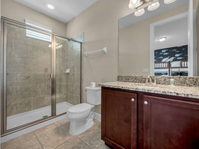 Bathroom with glass enclosed shower Bathroom with glass enclosed shower