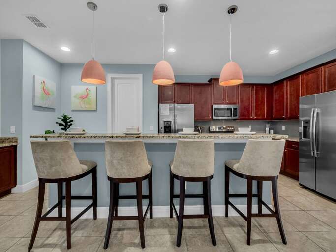 Kitchen area with stainless steel appliances, and spacious island Kitchen area with stainless steel appliances, and spacious island