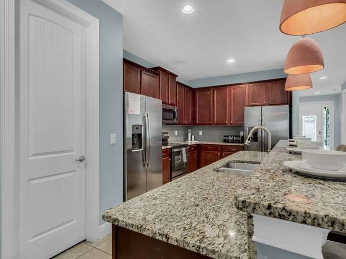 Kitchen area with stainless steel appliances, and spacious island Kitchen area with stainless steel appliances, and spacious island