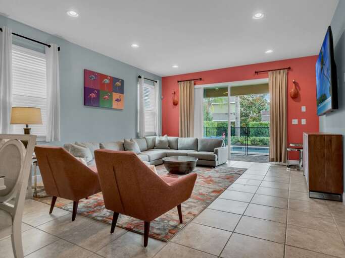 Living area with 86” flat screen TV and access to pool area Living area with 86” flat screen TV and access to pool area