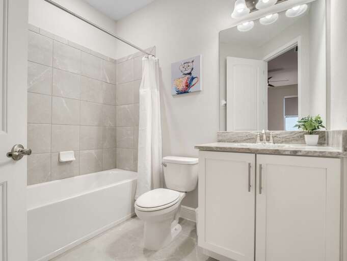 Bathroom with bathtub and shower combo