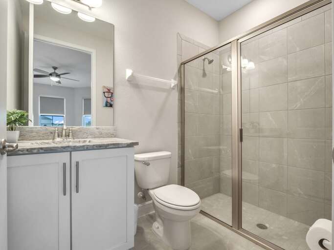 Bathroom with glass enclosed shower