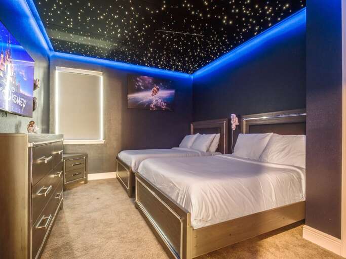 Deep space themed bedroom with dual Full beds