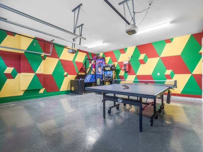 Game room with arcades and ping pong table