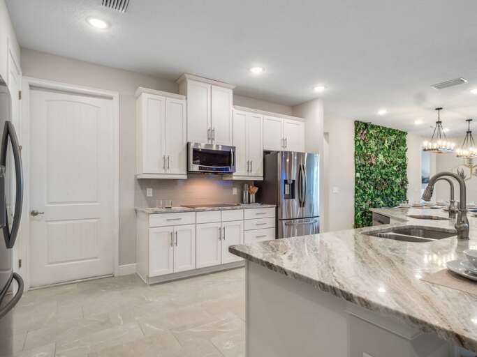 Kitchen area with stainless steel appliances and spacious island