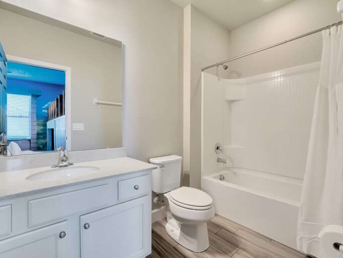 Bathroom with bathtub and shower combo