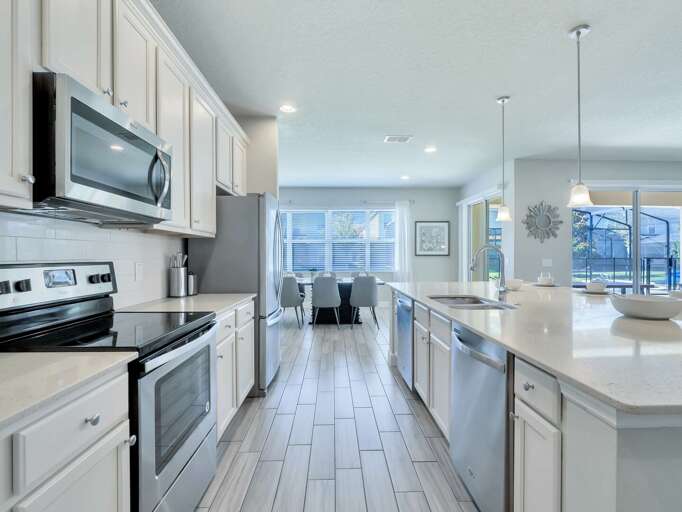 Kitchen area with stainless steel appliances and spacious island