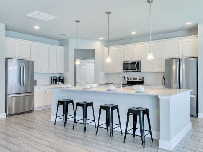 Kitchen area with stainless steel appliances and spacious island
