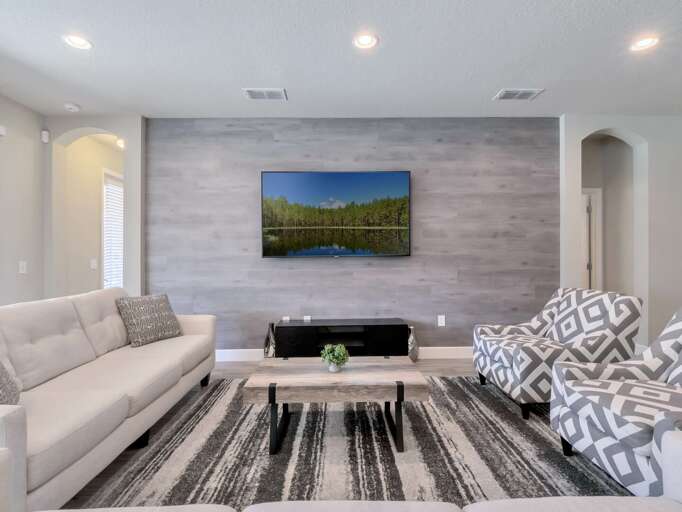 Living area with comfy sectional sofa and flat screen TV
