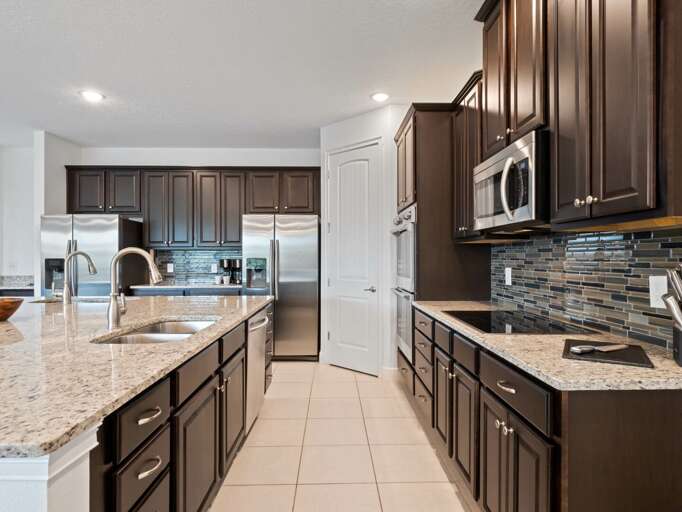 Kitchen area with stainless steel appliances and spacious island