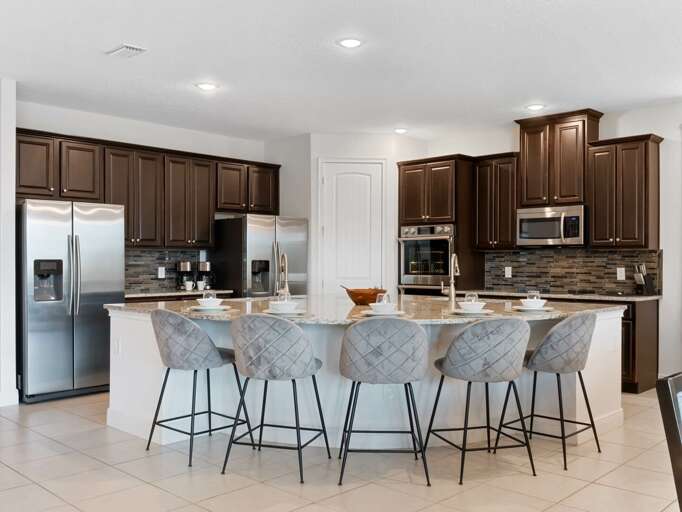 Kitchen area with stainless steel appliances and spacious island