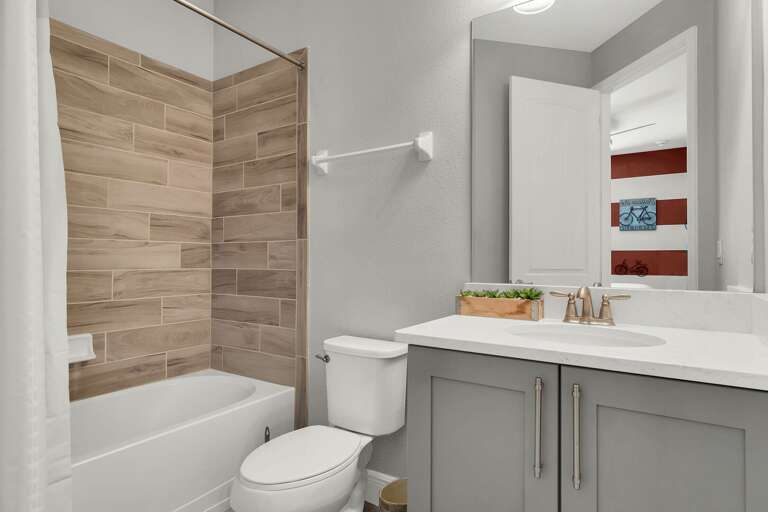 Bathroom with bathtub and shower combo