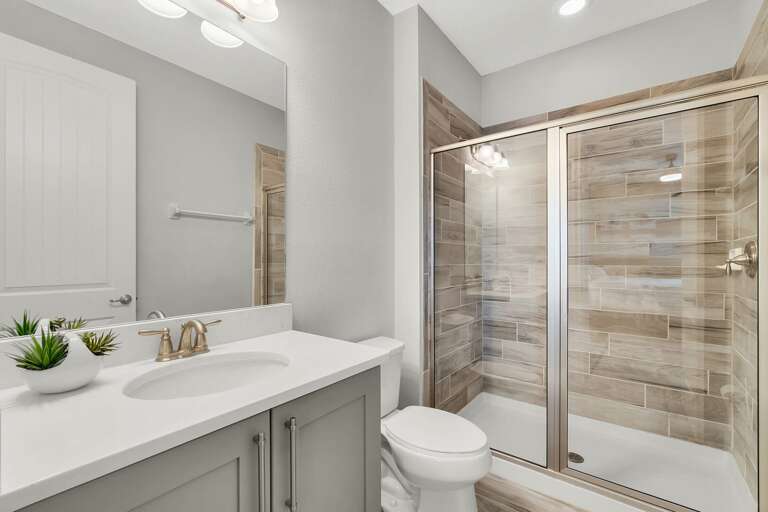 Bathroom with glass enclosed shower