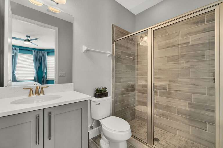 Bathroom with glass enclosed shower