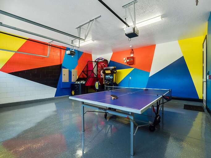 Game room with ping-pong table and arcades