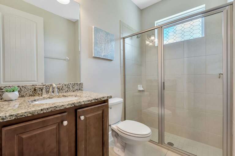 Bathroom with glass enclosed shower