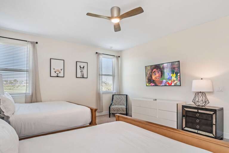 Bedroom with 2x King beds and flat screen TV