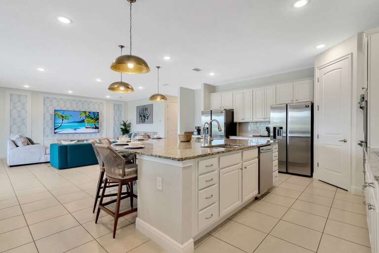 Kitchen area with spacious island and stainless-steel appliances