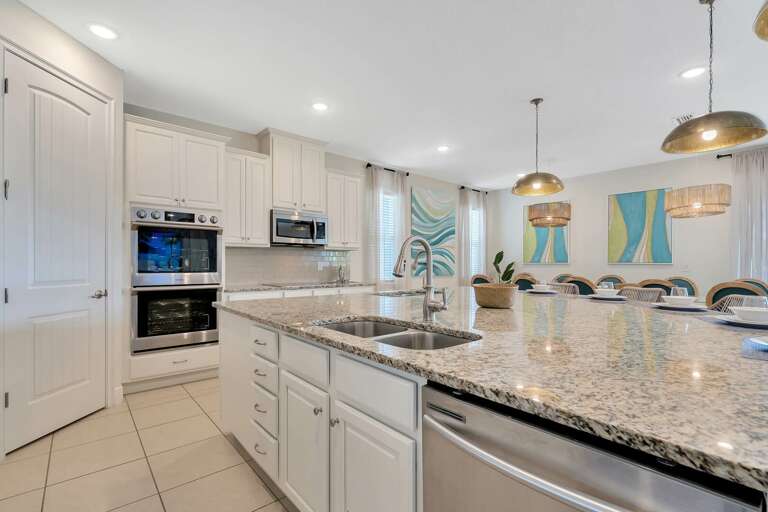 Kitchen area with spacious island and stainless-steel appliances