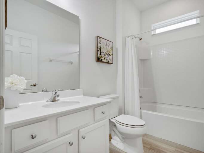 Bathroom with bathtub and shower combo