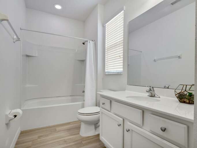 Bathroom with bathtub and shower combo