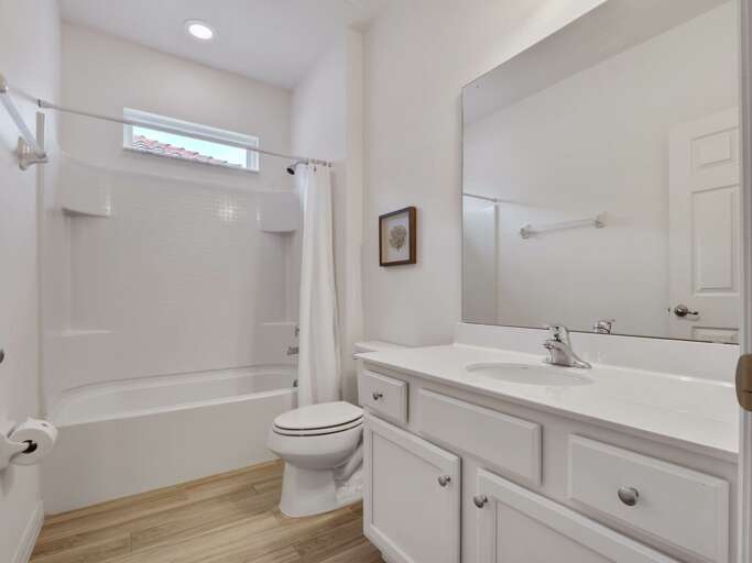Bathroom with bathtub and shower combo