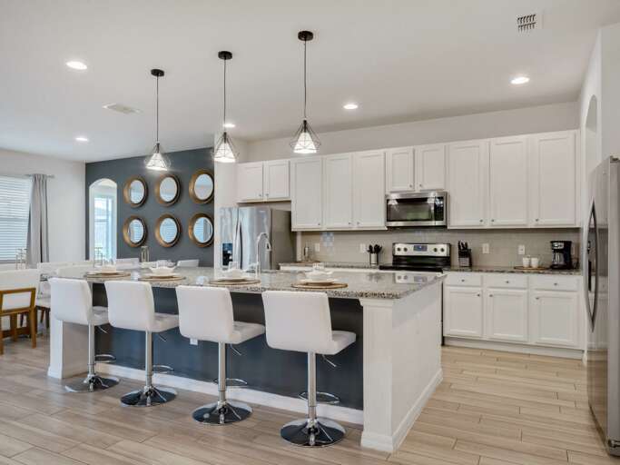 Kitchen area with stainless steel appliances and spacious island