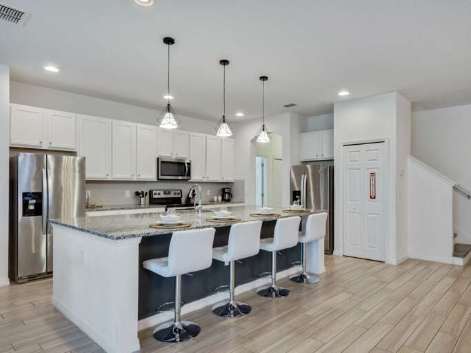 Kitchen area with stainless steel appliances and spacious island
