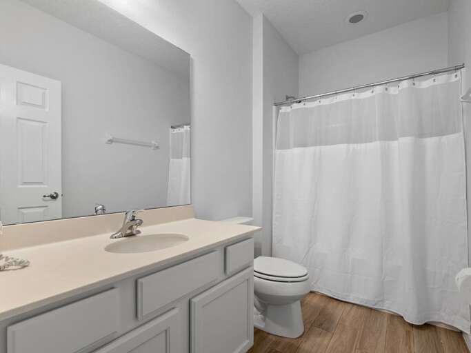 Bathroom with bathtub and shower combo